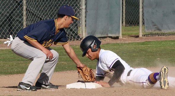 Lemoore's Abel Garza slides into third, one of his two triples against visiting Sunnyside High on Tuesday. The Tigers travel to Firebaugh Friday for a non-league game. The Tigers won the game 8-1.